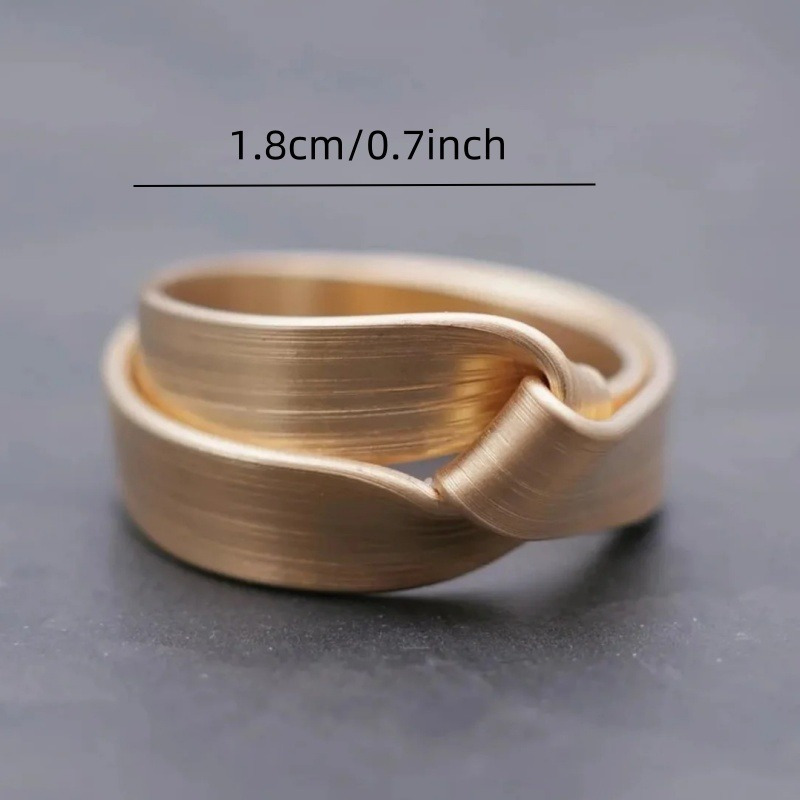 Geometric Twisted Band Ring Modern Polished Golden Finish